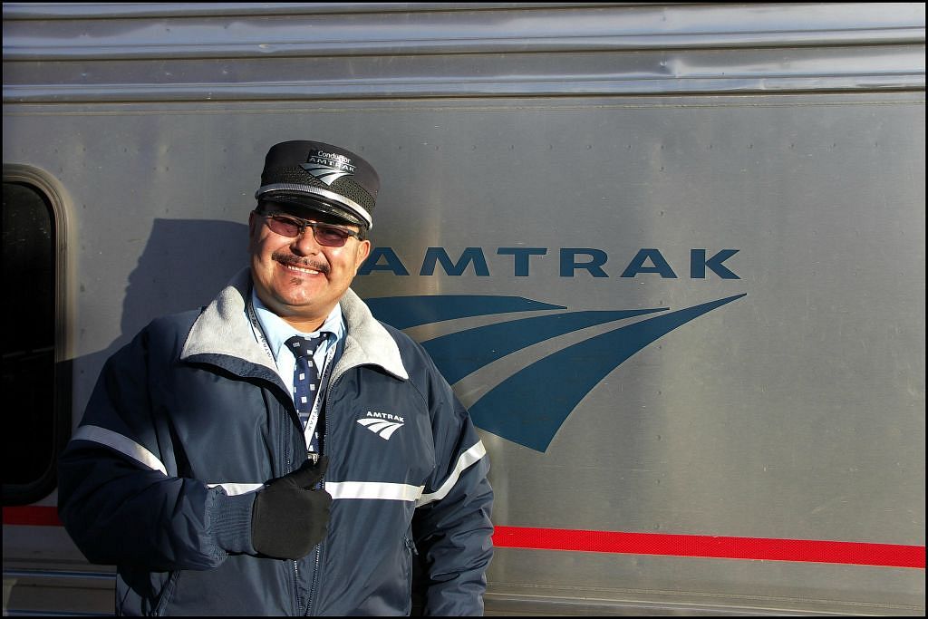  portrait of an amtrak train conductor